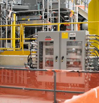 Pictured is the Unit 2 isotope irradiation system at Darlington, with various auxiliary equipment in the foreground, as found at the completion of the interim installation phase. Final connections to the reactor will be completed in late 2022.